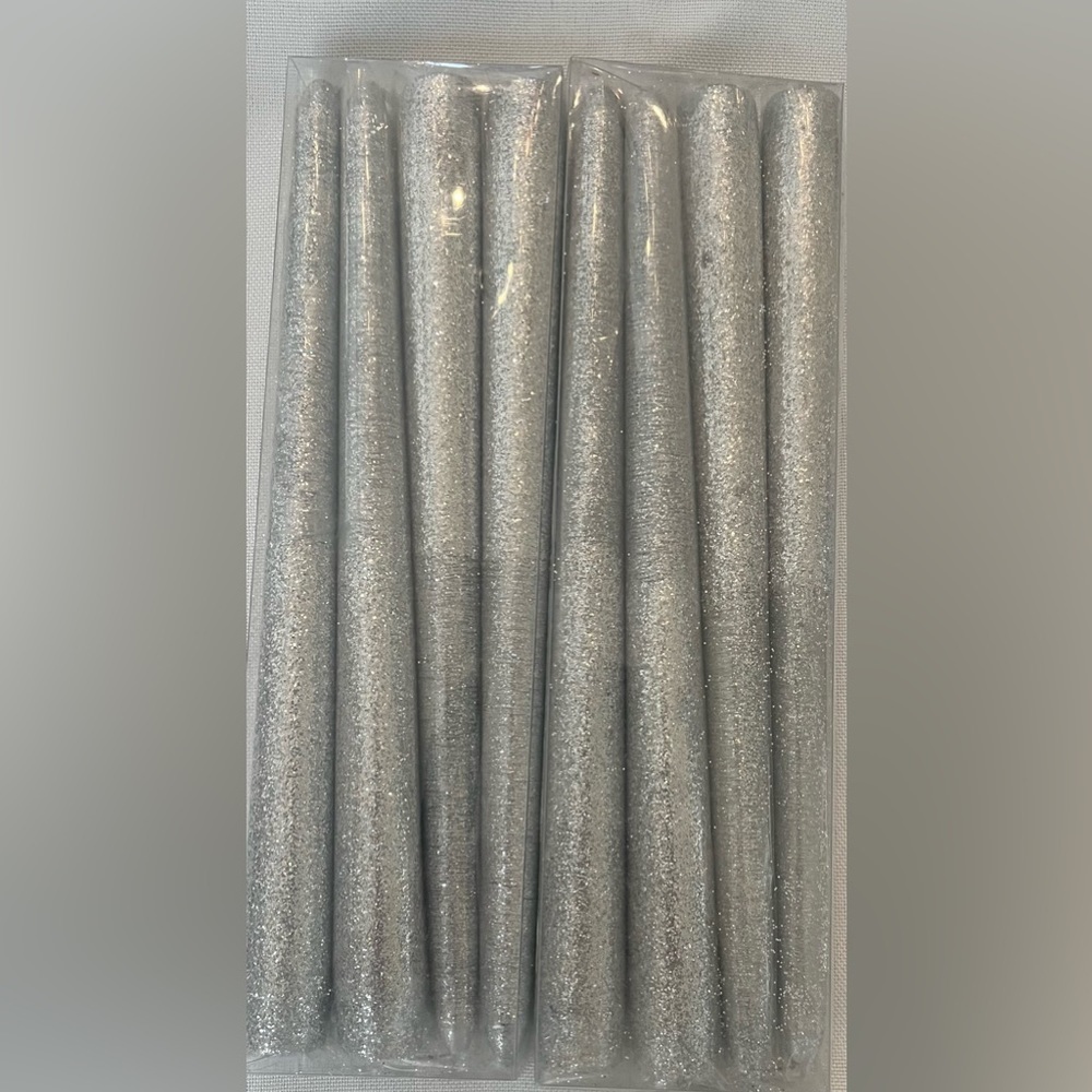 New in package 2 sets silver sparkly taper candles 8 total